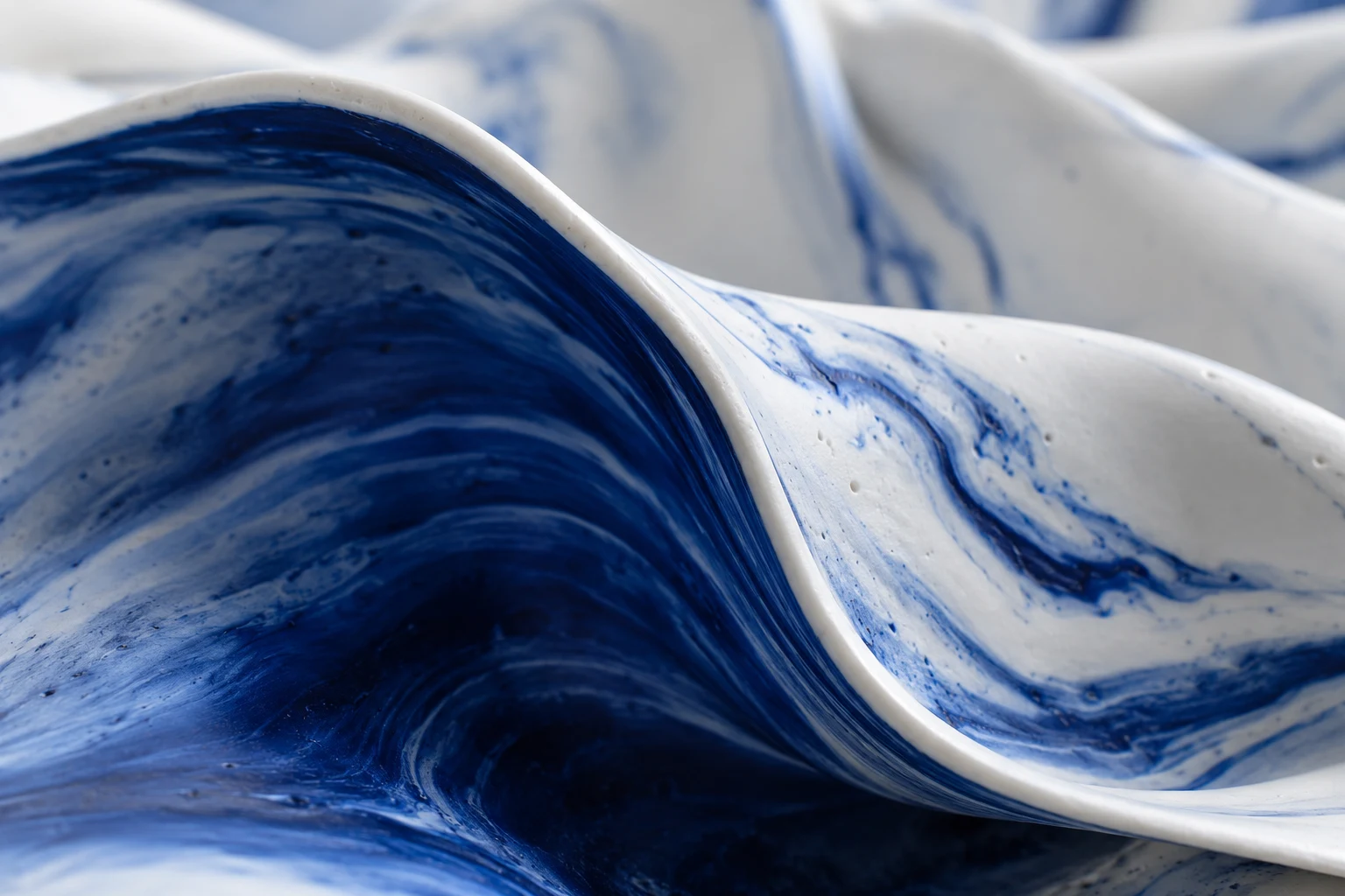 A close view of Draft's sculptural blue and white porcelain.
